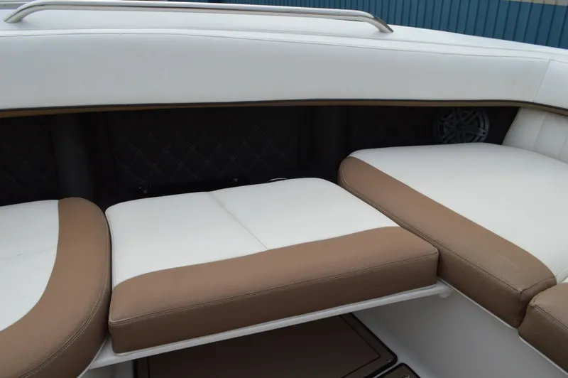 Slide: The Image of 2016 Cobalt 302 boat interior with white and brown cushioned seating. - 20