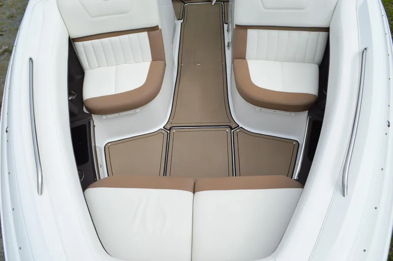 Slide: The Image of Interior of a 2016 Cobalt 302 boat with white and tan seating. - 26