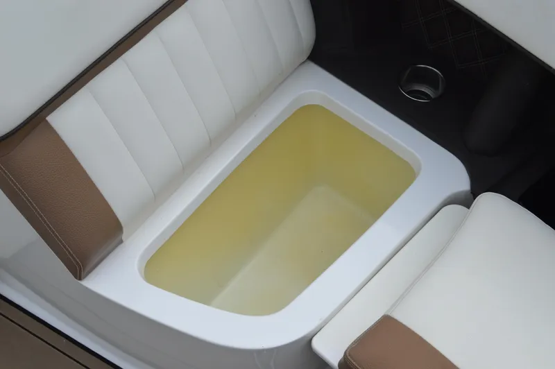 Slide: The Image of Interior seating of 2016 Cobalt 302 boat with integrated storage compartment. - 33