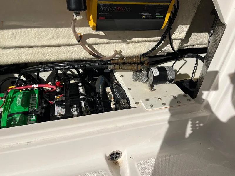 Slide: The Image of 2021 Robalo R272 Center Console boat battery and electrical components. - 10