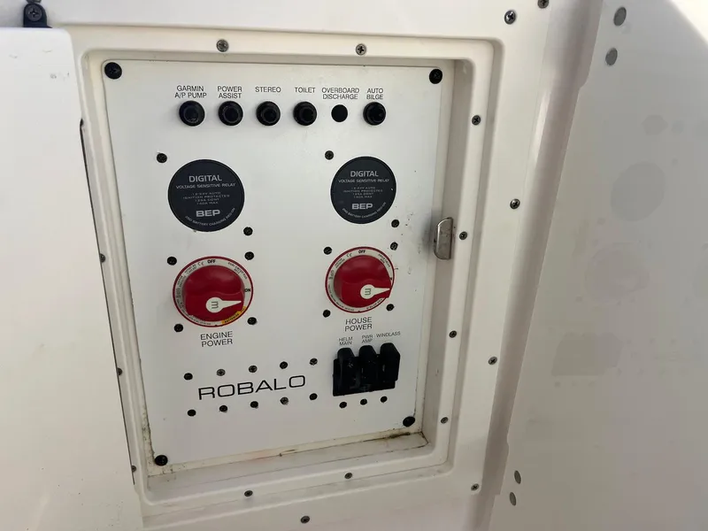 Slide: The Image of Control panel of 2021 Robalo R272 Center Console boat with switches and dials. - 30