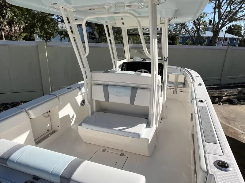 Slide: The Image of 2021 Robalo R272 Center Console boat interior with seating and console view. - 4