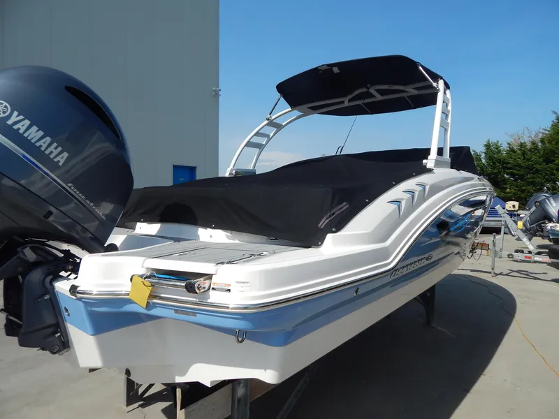 Slide: The Image of 2022 Chaparral 23 SSi OB boat with Yamaha outboard motor, docked outdoors. - 25