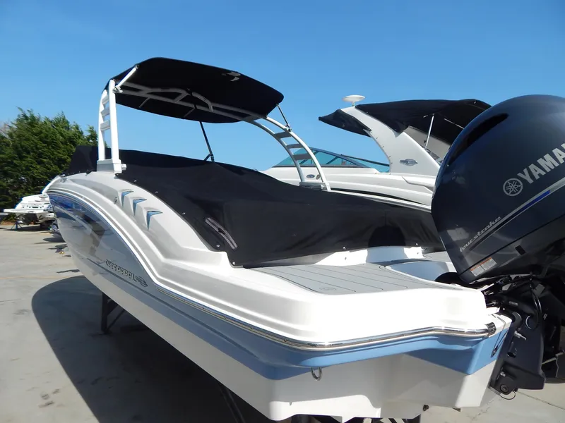 Slide: The Image of 2022 Chaparral 23 SSi OB boat with Yamaha outboard engine, covered and docked. - 28