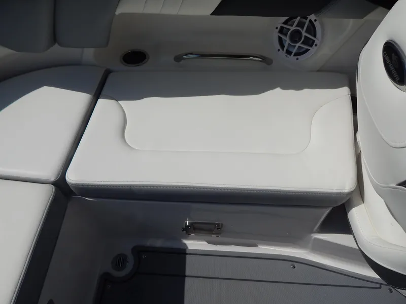 Slide: The Image of 2022 Chaparral 23 SSi OB boat interior seating with speaker and storage compartment. - 49