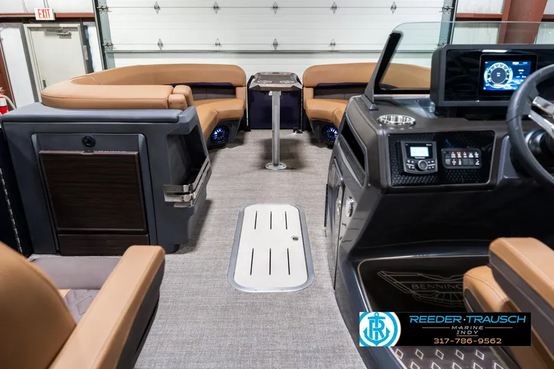 Slide: The Image of 2025 Bennington 24 MSB boat interior with luxurious seating and modern dashboard. - 20