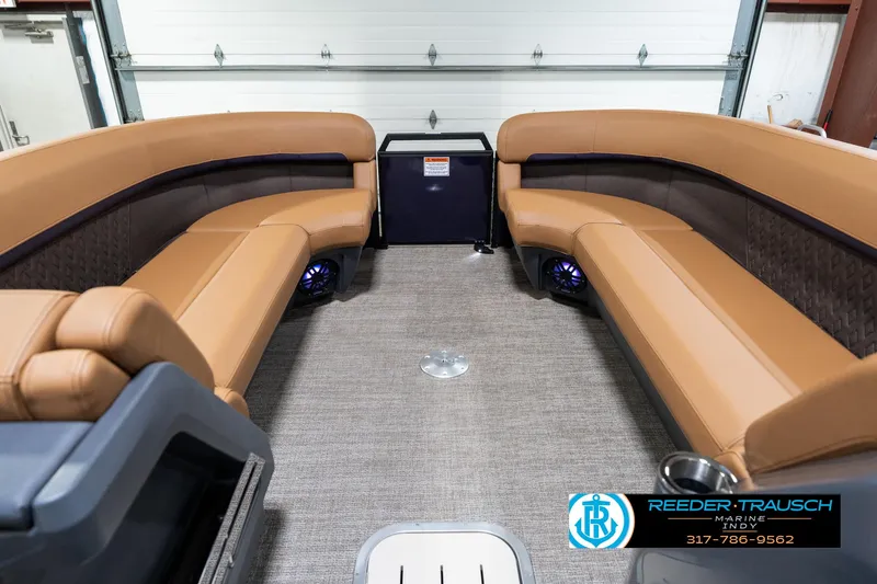 Slide: The Image of 2025 Bennington 24 MSB boat interior with tan seating and modern design. - 22