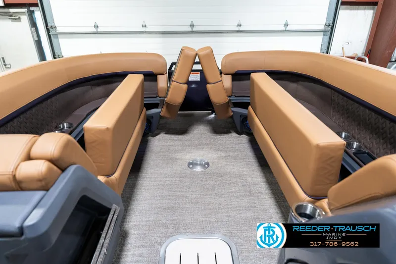 Slide: The Image of 2025 Bennington 24 MSB boat interior with tan seating and carpeted floor. - 23