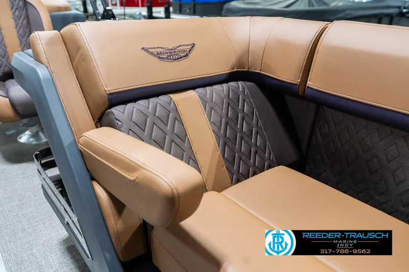 Slide: The Image of Luxurious seating in 2025 Bennington 24 MSB boat with tan and gray upholstery. - 25