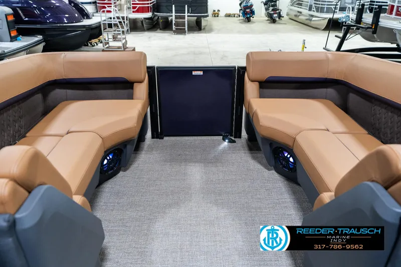 Slide: The Image of 2025 Bennington 24 MSB boat interior with tan seating and carpeted floor. - 26