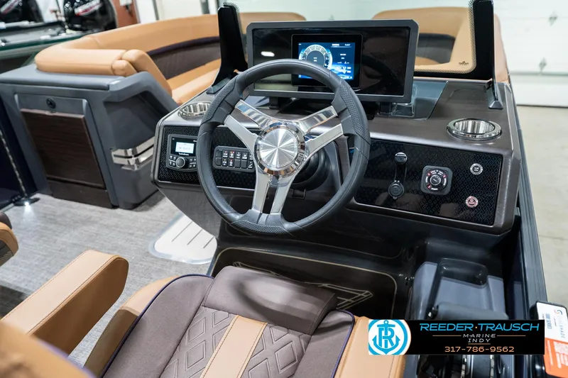 Slide: The Image of 2025 Bennington 24 MSB boat dashboard with modern steering wheel and digital display. - 30