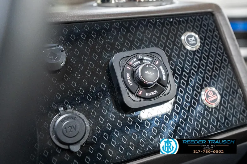 Slide: The Image of Control panel of 2025 Bennington 24 MSB boat with various buttons and switches. - 36