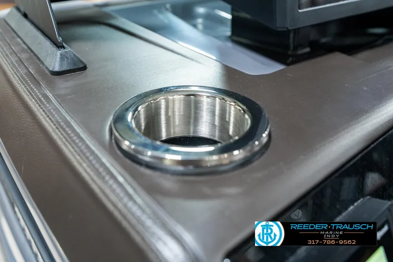 Slide: The Image of Cup holder on 2025 Bennington 24 MSB boat dashboard, featuring sleek design and metallic finish. - 43