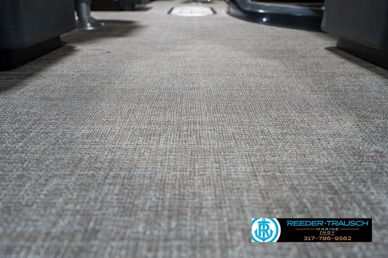 Slide: The Image of 2025 Bennington 24 MSB boat interior flooring, featuring textured carpet design. - 45