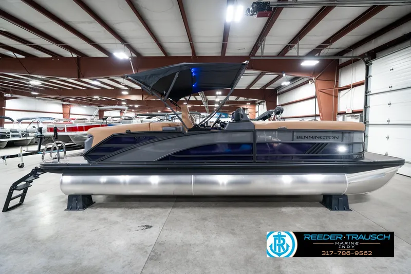 Slide: The Image of 2025 Bennington 24 MSB pontoon boat in showroom, side view with canopy. - 7