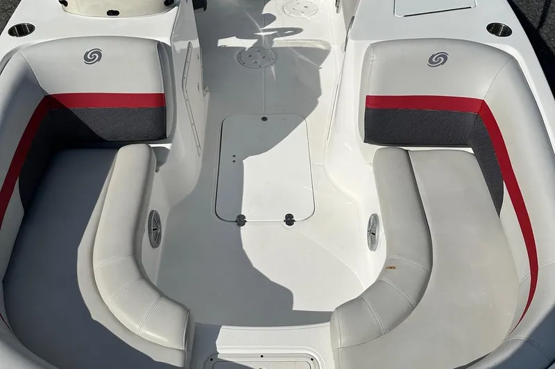 Slide: The Image of 2018 Godfrey Hurricane 188SD boat interior with white and red seating. - 11