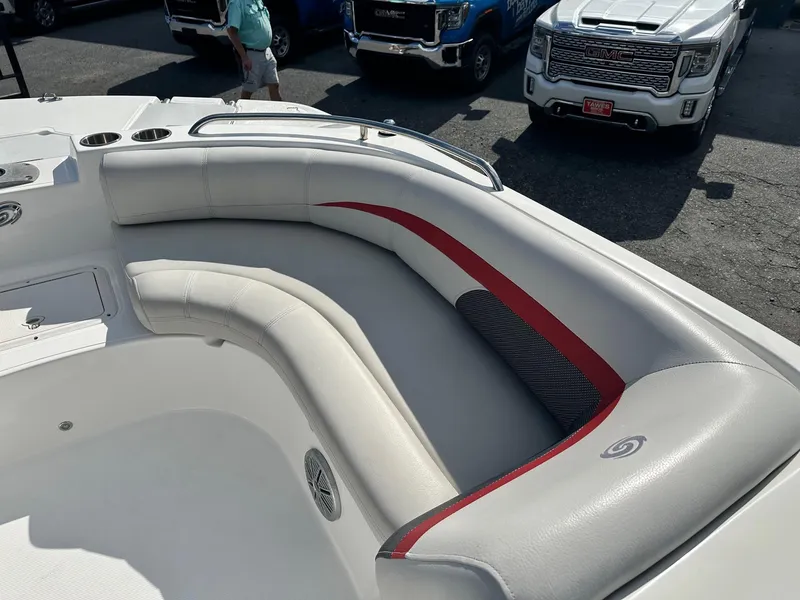 Slide: The Image of 2018 Godfrey Hurricane 188SD boat interior with white and red seating. - 13