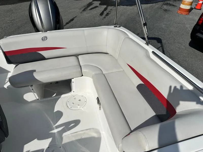 Slide: The Image of 2018 Godfrey Hurricane 188SD boat interior with white and red seating. - 15