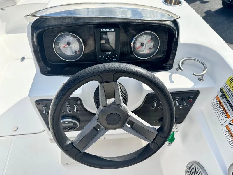 Slide: The Image of Steering console of 2018 Godfrey Hurricane 188SD boat with gauges and controls. - 6