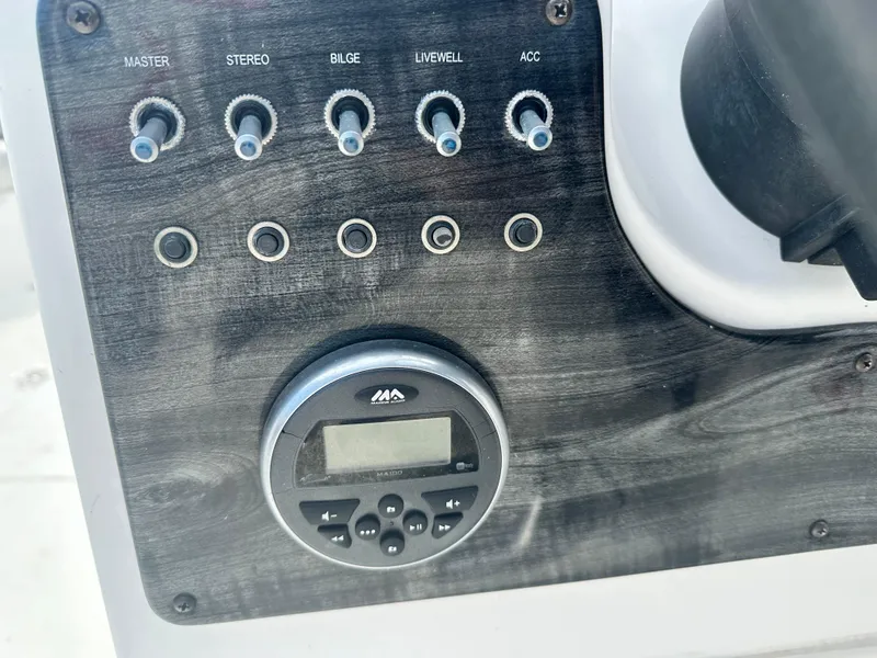 Slide: The Image of Control panel of 2018 Godfrey Hurricane 188SD boat with switches and digital display. - 7