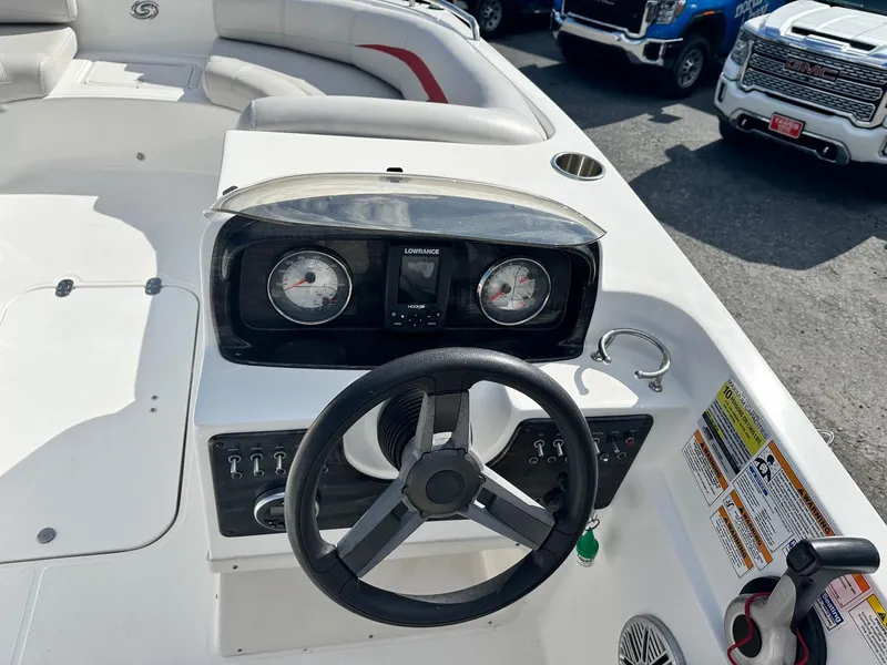 Slide: The Image of 2018 Godfrey Hurricane 188SD boat dashboard with steering wheel and gauges. - 8