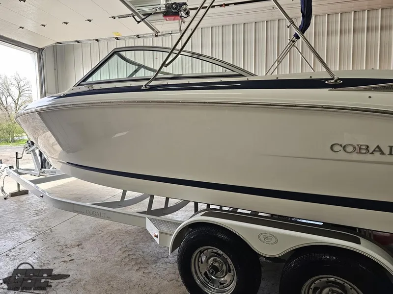 Slide: The Image of 2009 Cobalt 232 boat on trailer in garage setting. - 14