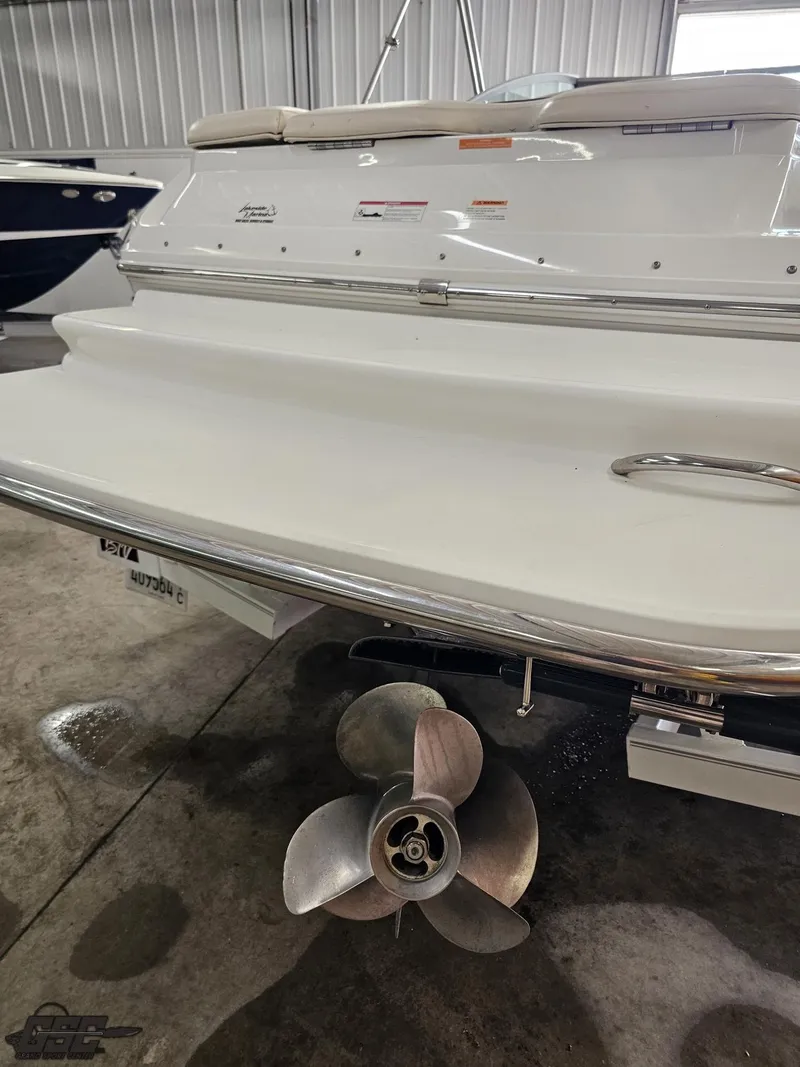 Slide: The Image of 2009 Cobalt 232 boat stern with propeller in a storage facility. - 20
