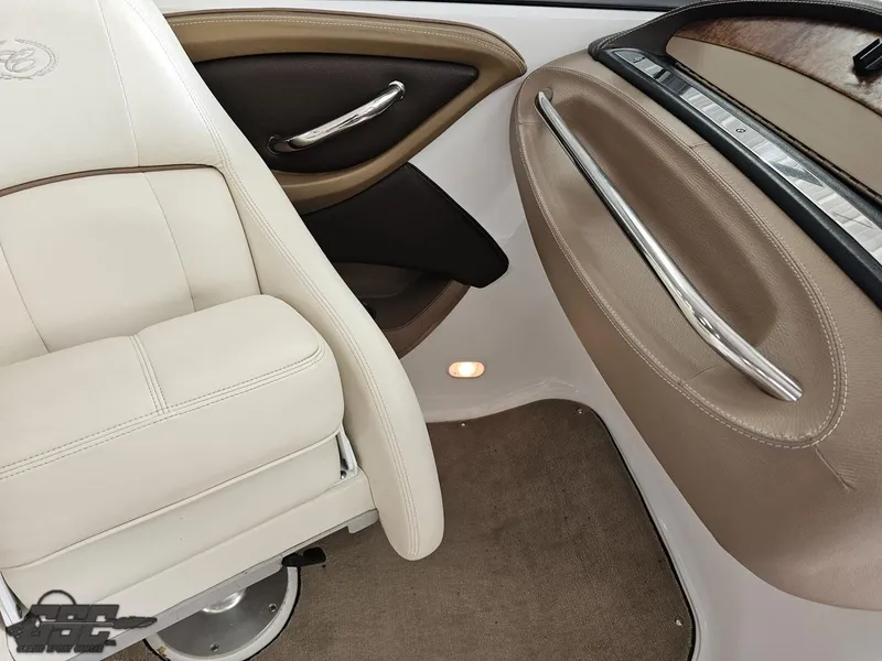Slide: The Image of 2009 Cobalt 232 interior with beige leather seats and sleek door handles. - 37