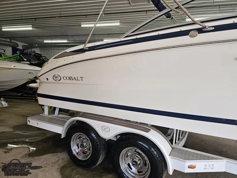 Slide: The Image of 2009 Cobalt 232 boat on trailer in indoor storage facility. - 4