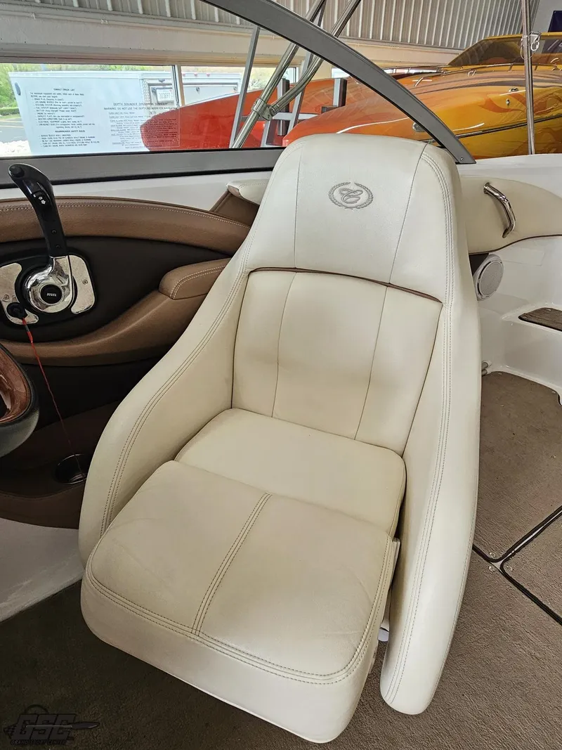 Slide: The Image of 2009 Cobalt 232 boat interior with beige leather seat and sleek design. - 42