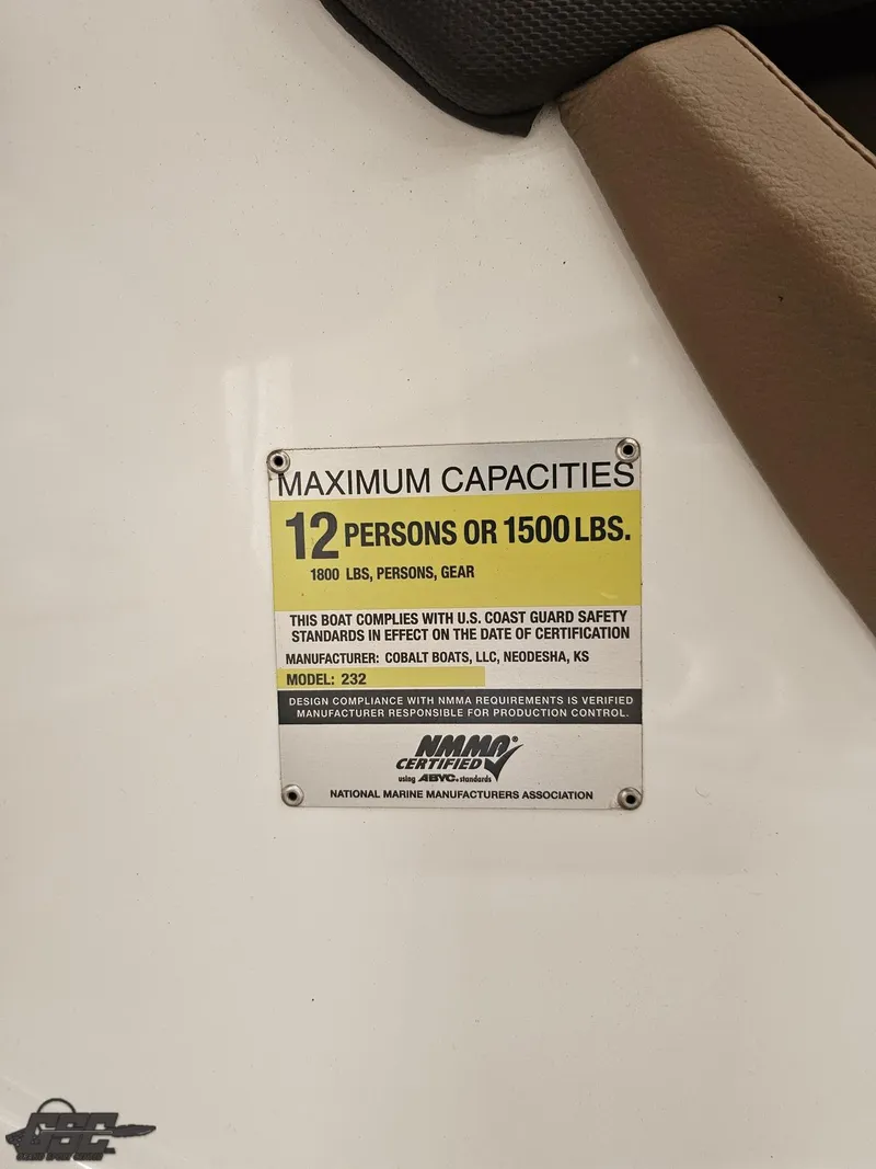 Slide: The Image of Capacity label on 2009 Cobalt 232 boat: 12 persons or 1500 lbs. - 45