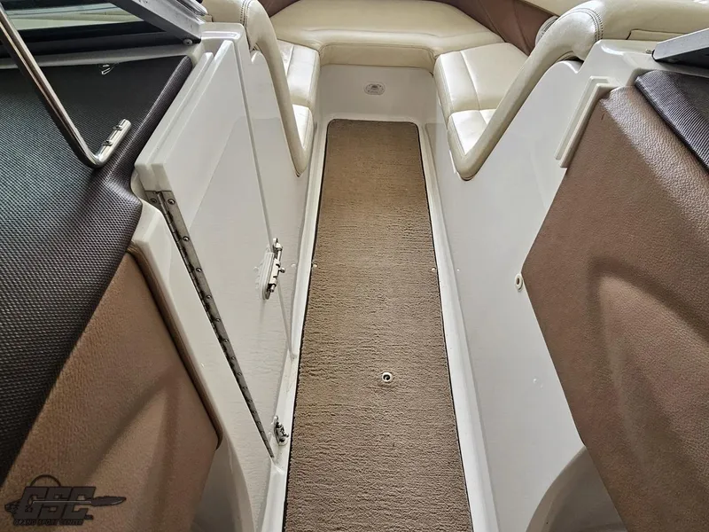 Slide: The Image of Interior view of a 2009 Cobalt 232 boat, featuring seating and storage compartments. - 49