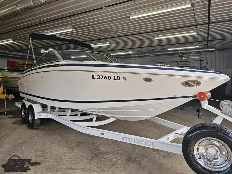 Slide: The Image of 2009 Cobalt 232 boat on trailer in indoor storage facility. - 7