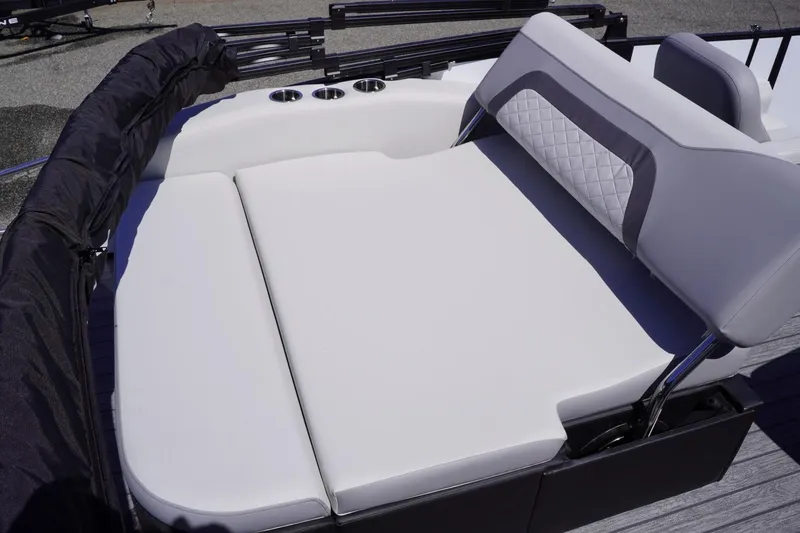 Slide: The Image of 2025 Lowe SS 210 DL boat with spacious, cushioned seating and cup holders. - 15