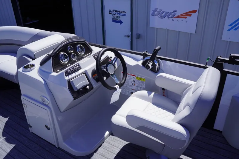 Slide: The Image of 2025 Lowe SS 210 DL boat cockpit with steering wheel and control panel. - 9