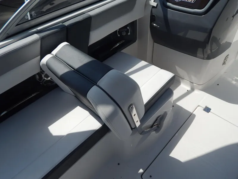 Slide: The Image of 2019 Chaparral 230 Suncoast boat interior with adjustable seating and sleek design. - 19