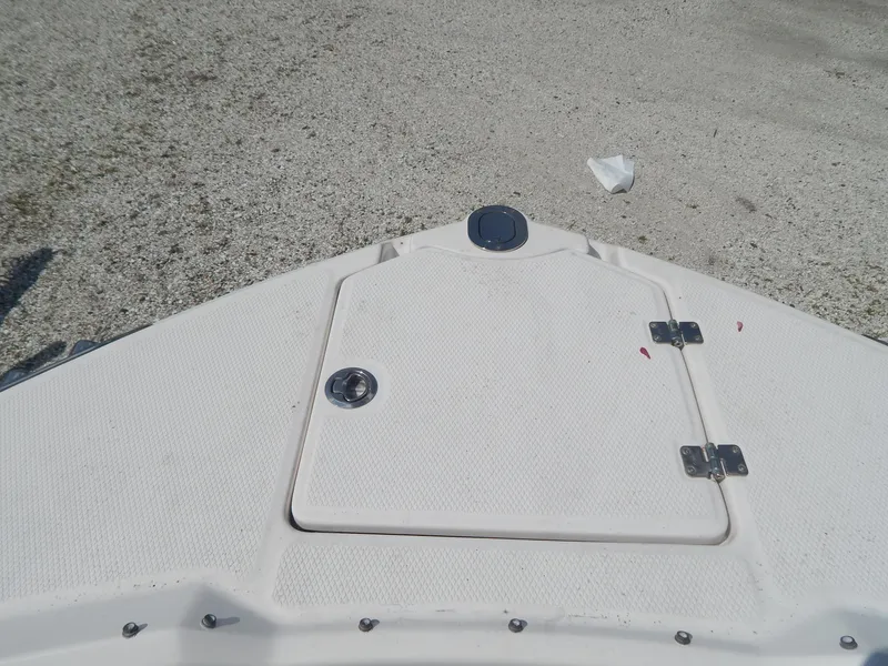 Slide: The Image of Bow of 2019 Chaparral 230 Suncoast boat with storage hatch. - 30
