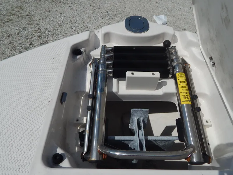 Slide: The Image of 2019 Chaparral 230 Suncoast boat anchor storage compartment with stainless steel fittings. - 31