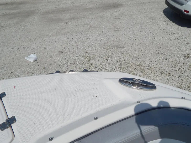 Slide: The Image of 2019 Chaparral 230 Suncoast boat deck, white surface, outdoor setting. - 32