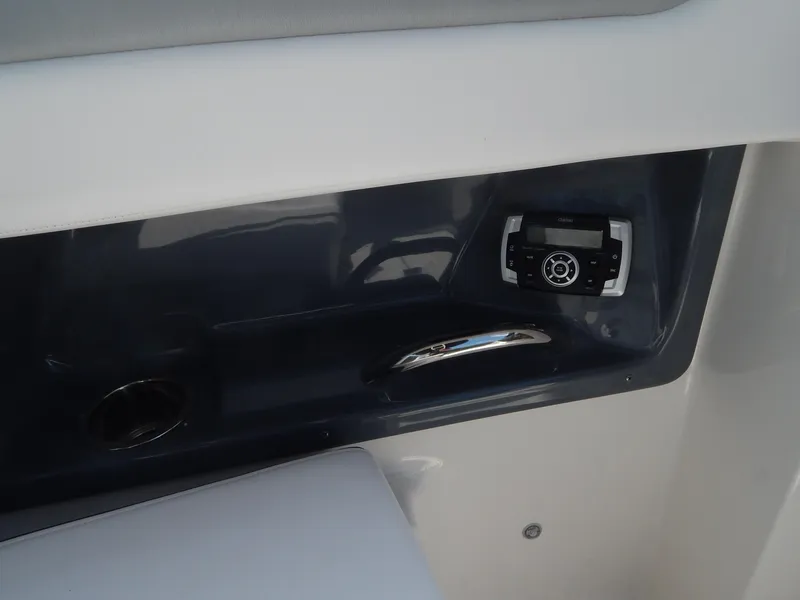 Slide: The Image of Interior view of 2019 Chaparral 230 Suncoast boat with control panel. - 35