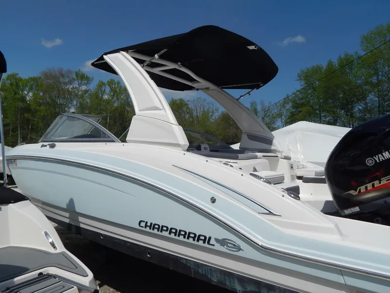 Slide: The Image of 2019 Chaparral 230 Suncoast boat with sleek design and Yamaha engine, outdoors. - 38