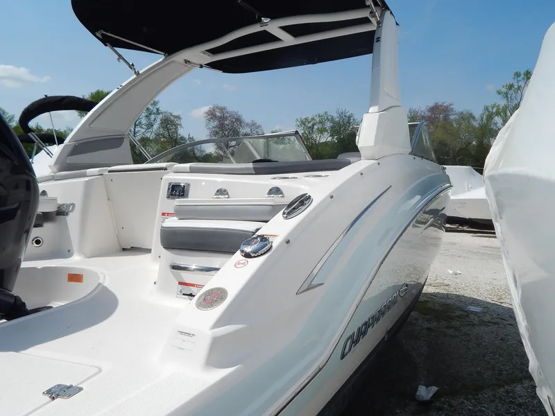 Slide: The Image of 2019 Chaparral 230 Suncoast boat with sleek design and modern features, docked outdoors. - 39