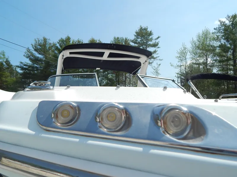 Slide: The Image of 2019 Chaparral 230 Suncoast boat with sleek design and modern features, set against a clear sky. - 41