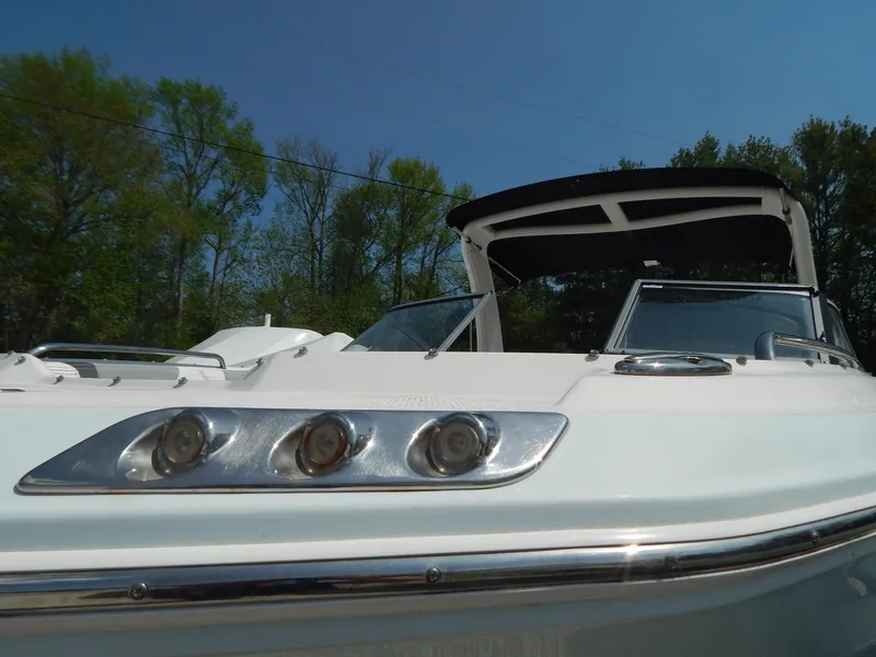 Slide: The Image of 2019 Chaparral 230 Suncoast boat with sleek design and modern features, under clear blue sky. - 43