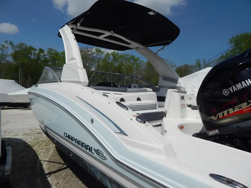 Slide: The Image of 2019 Chaparral 230 Suncoast boat with Yamaha engine, docked outdoors. - 8