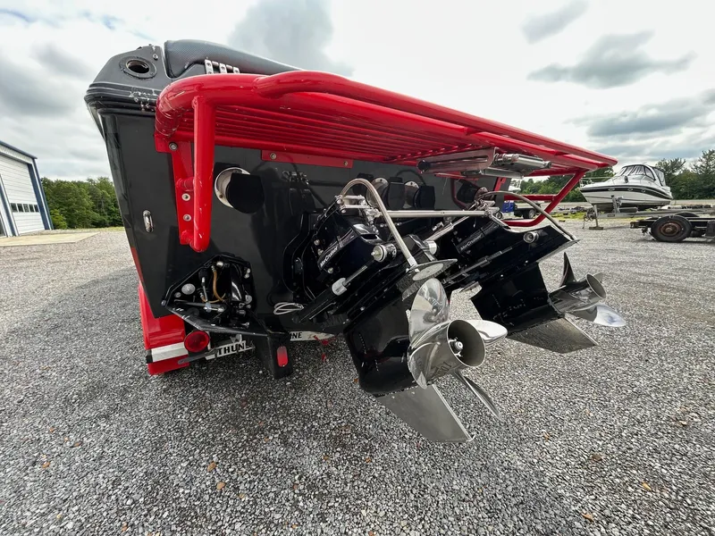 Slide: The Image of 2006 Baja Outlaw boat rear view with dual propellers and red accents. - 6