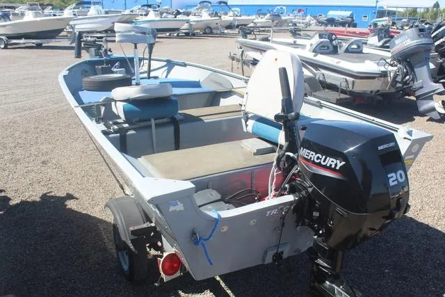 Slide: The Image of 2016 Tracker Guide V-14 Deep V boat with Mercury 20 engine in a boatyard. - 4