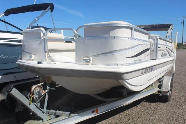 Slide: The Image of 2007 Hurricane FunDeck 196 RE3 boat on trailer, parked outdoors. - 3