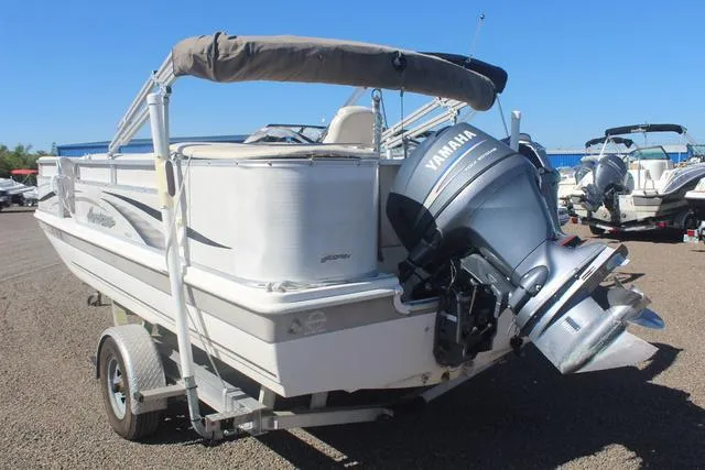 Slide: The Image of 2007 Hurricane FunDeck 196 RE3 boat with Yamaha outboard motor on trailer. - 6