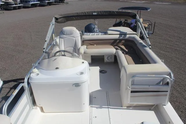 Slide: The Image of 2007 Hurricane FunDeck 196 RE3 boat interior with seating and steering console. - 7